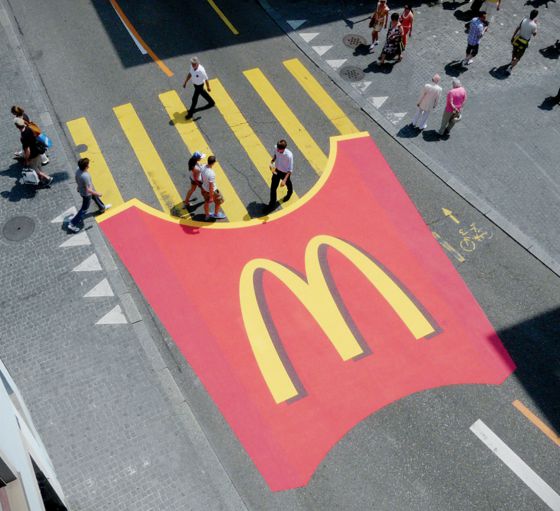 mcdonalds guerilla marketing example of zebra crossing painted into mcdonalds fries with people walking across it